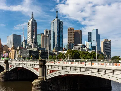 Princes Bridge over the Yarra River with the spires of St Paul's Cathedral and the Melbourne city towers behind